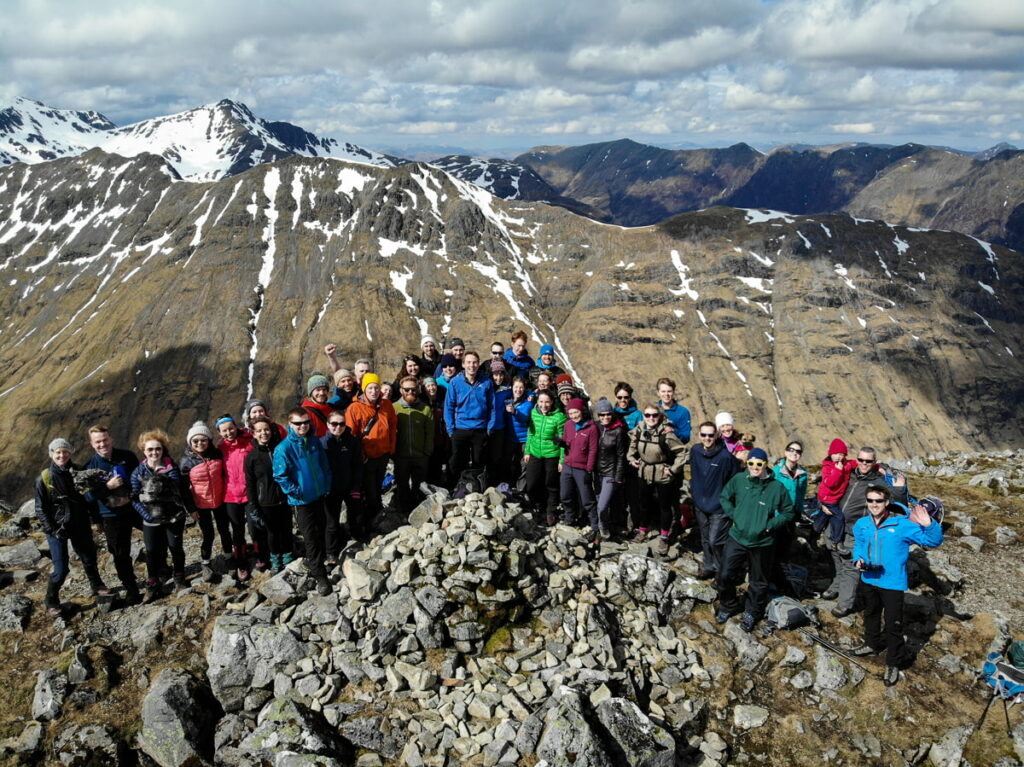 Walkers on the summit of Buachaille Etive Beag, Scottish Highlands