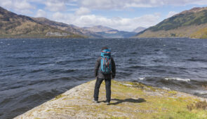 Walker taking in the view of Loch Lomond from Rowardennan