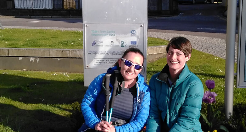 Happy walkers at the end of the West Highland Way in Fort William