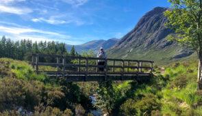 Hiker in spectacular scenery near Tyndrum