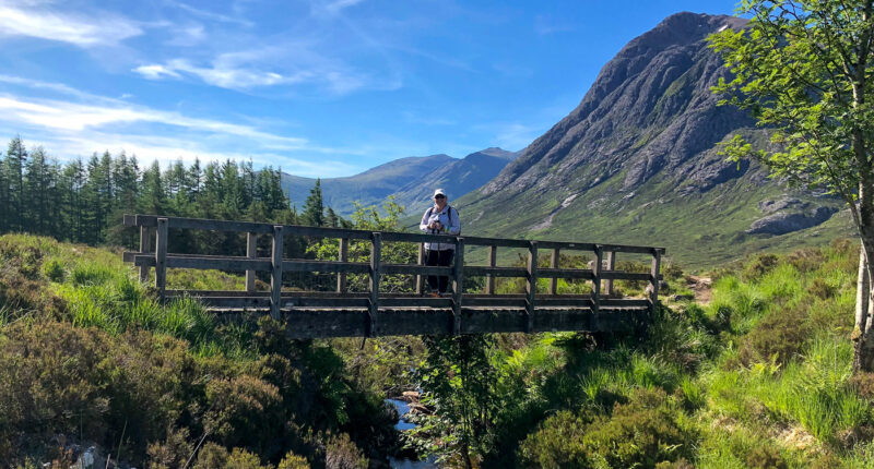 Hiker in spectacular scenery near Tyndrum