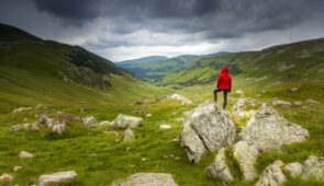 Hiker looking into the distance on the mountain