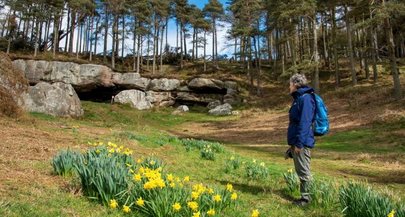 Our client, Anne, at St Cuthbert's Cave (credit - Peter Backhouse)