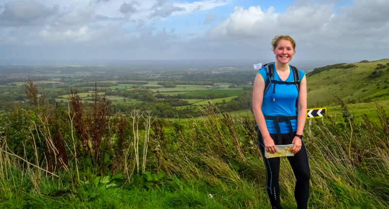 Charlotte from Absolute Escapes walking the South Downs Way