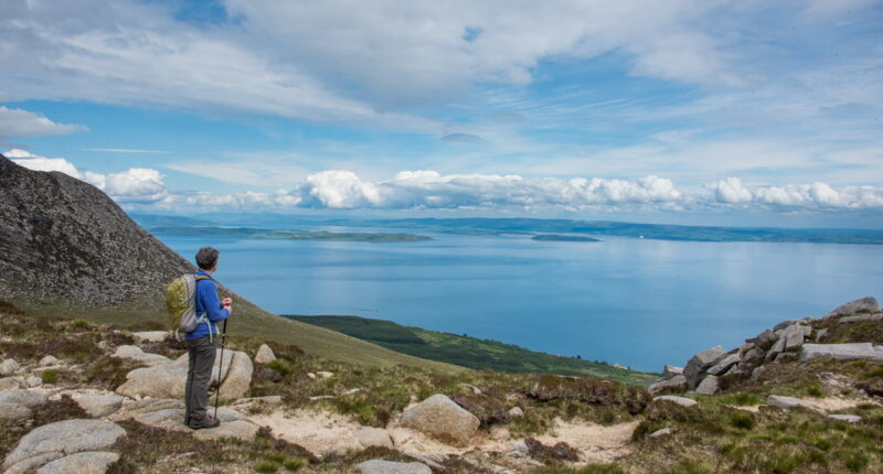 An Absolute Escapes client admiring the view of the Arran coast (credit - Peter Backhouse)