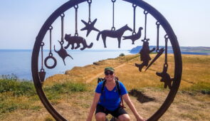 Sine from the Absolute Escapes team with the Charm Bracelet sculpture at Saltburn on the Cleveland Way by artist, Richard Farrington (credit - Sine Birkedal Nielsen)