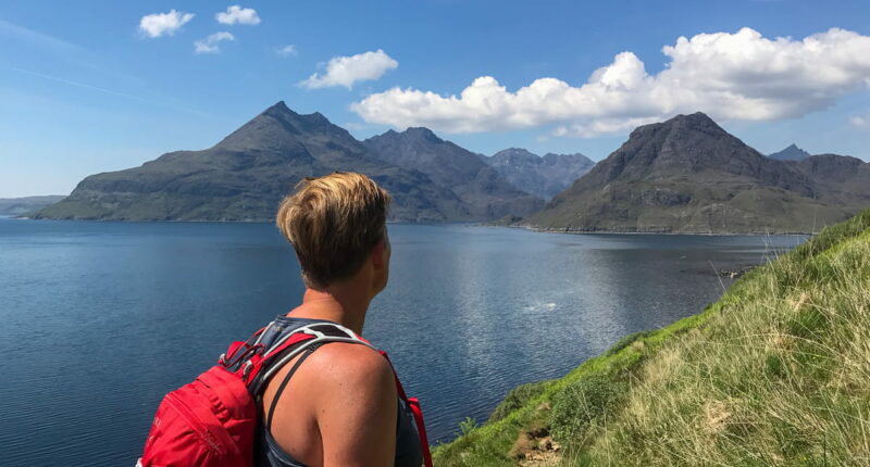 An Absolute Escapes client admiring the views of The Cuillin across Loch Scavaig (credit - Wiki Ulrich)