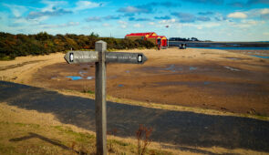 Norfolk Coast Path waymarker with National Trails acorn symbol