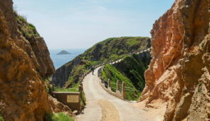 An Absolute Escapes client walking on the Guernsey Coastal Path (credit - Andrew Bond)