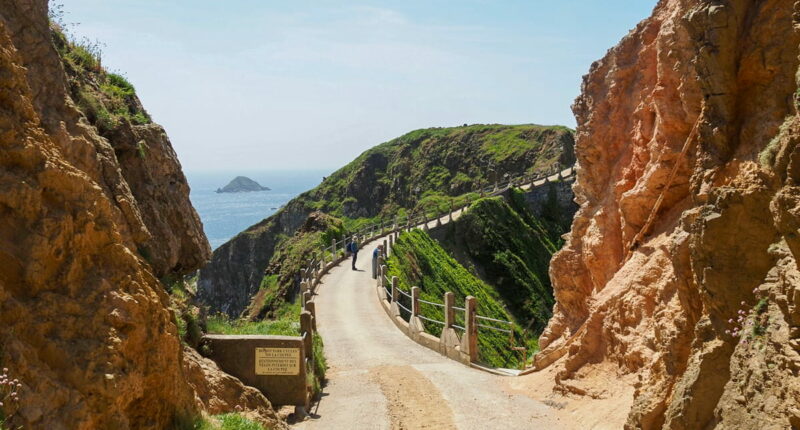 An Absolute Escapes client walking on the Guernsey Coastal Path (credit - Andrew Bond)