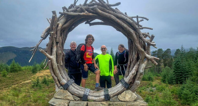 Absolute Escapes clients at the Viewcatcher sculpture on the Great Glen Way (credit - Brian Bence)