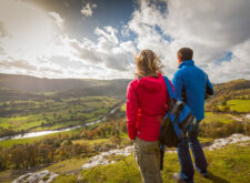 Walkers on Offa's Dyke Path overlooking Vale of Llangollen