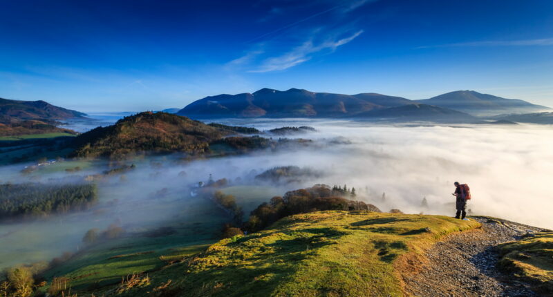 Fell walker ascending Catbells, The Lake District, Cumbria, England (credit - Michael Conrad)