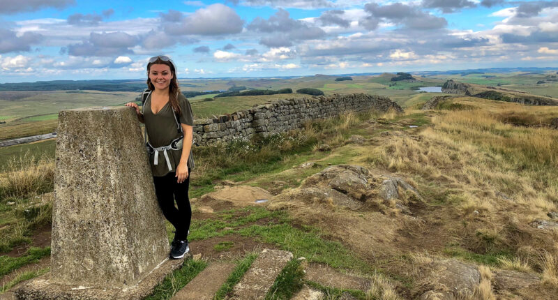 Caitlin from Absolute Escapes on the Hadrina's Wall Path at Caw Gap