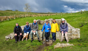 Walkers at the Temple of Mithras on Hadrian's Wall