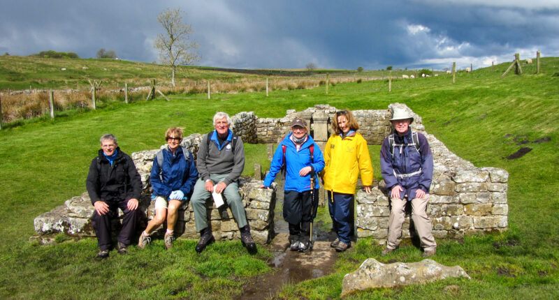 Walkers at the Temple of Mithras on Hadrian's Wall
