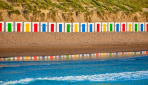 Colourful beach huts at Woolacombe beach