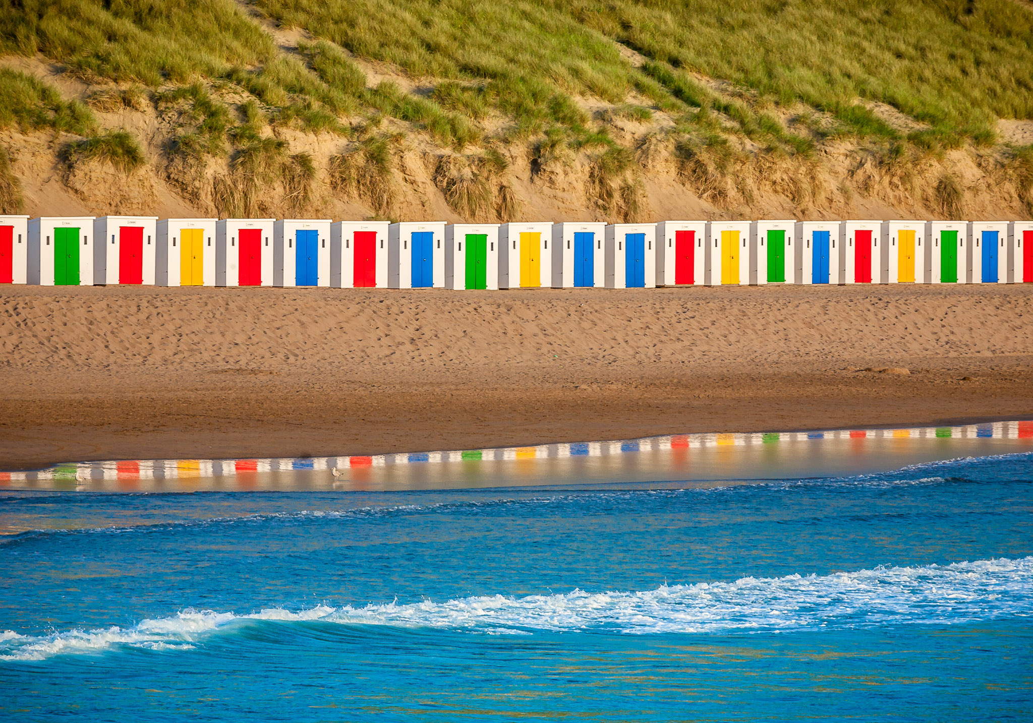 Colourful beach huts at Woolacombe beach