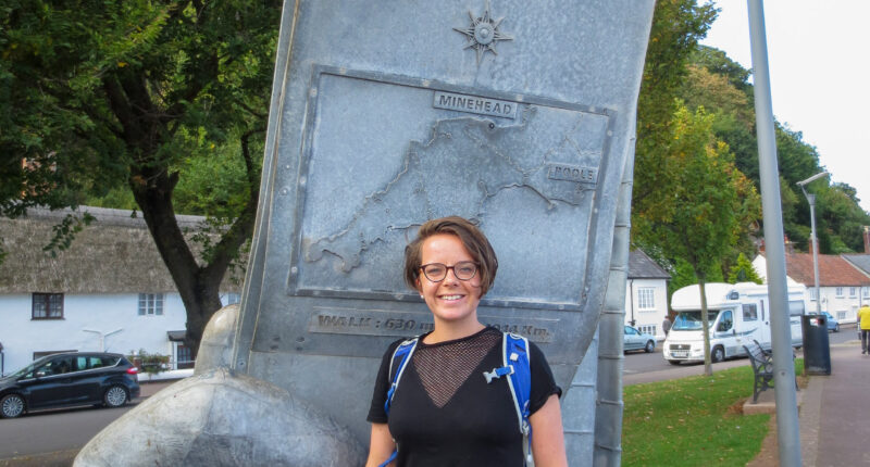 Caitlin from Absolute Escapes at the start of the South West Coast Path in Minehead