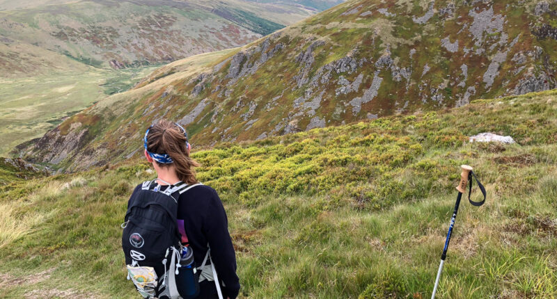 Hiker heading down to the mountain refuge at Auchope Cairn