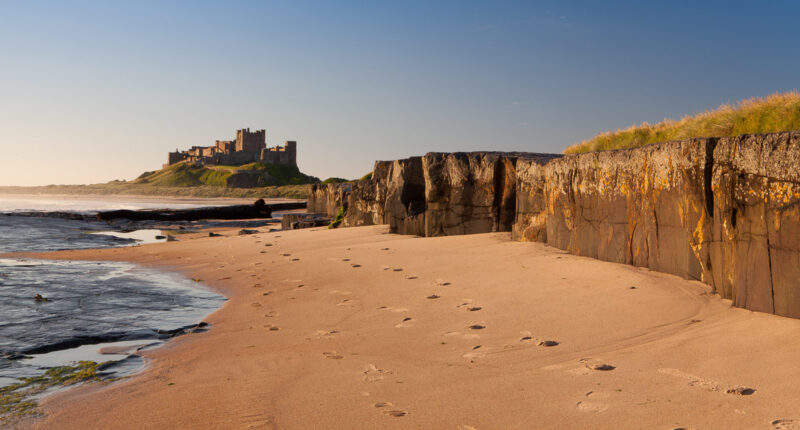 Sandy beach looking towards Bamburgh Castle