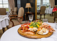 A platter of seafood in the middle of a dinner table in a high-end Scottish restaurant