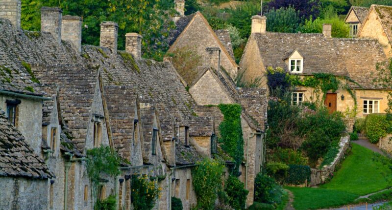 Quaint stone cottages in the Cotswold village of Bibury