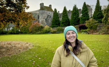 Female standing outside Falkland Palace in Autumn