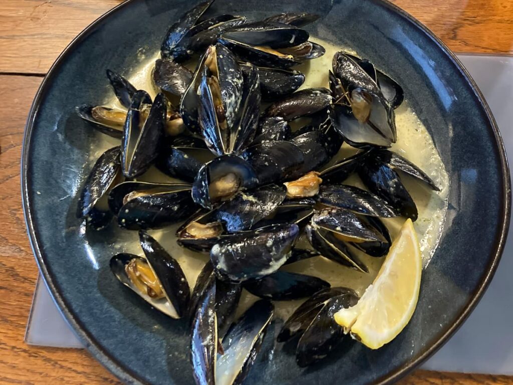 Freshly steamed mussels served at the Lobster Pot restaurant - perfect for walkers refuelling on Anglesey.