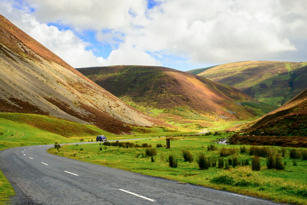 Car route through the scenic Mennock Pass in Southern Scotland – a highlight of a self-drive tour