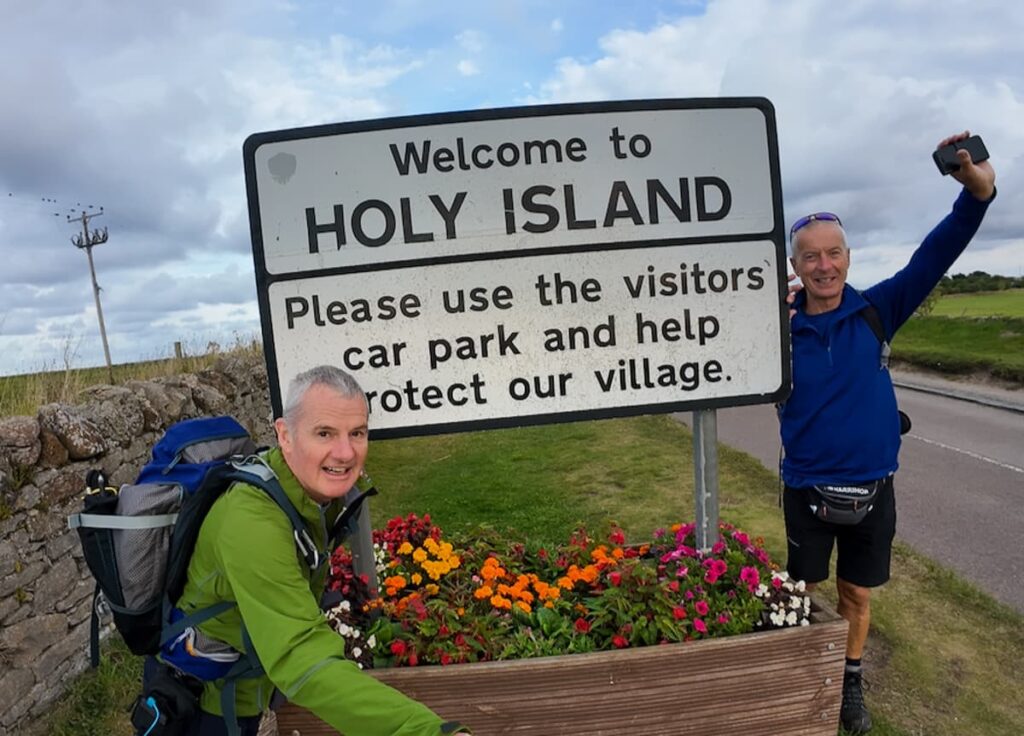 Welcome to Holy Island sign at Lindisfarne, the final destination when walking St Cuthbert's Way pilgrimage route