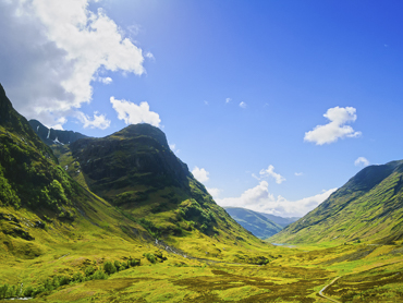 Dramatic mountain landscape of Glencoe in the Scottish Highlands - iconic Highland scenery featured in road trip itineraries in Scotland's most breathtaking region