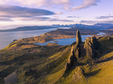 Old Man of Storr rock formation at sunrise on Isle of Skye - dramatic Highland landmark featured in road trip itineraries in Scotland's most magical island