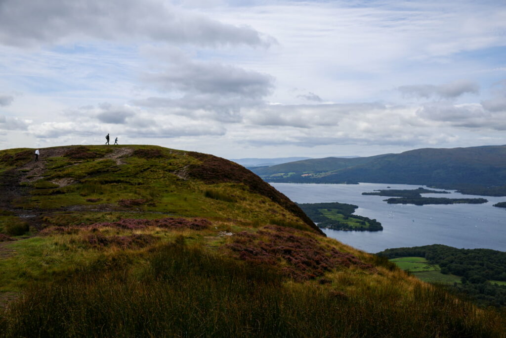 Panoramic view from Conic Hill along the West Highland Way, overlooking Loch Lomond and rolling hills – stunning West Highland Way photos.
