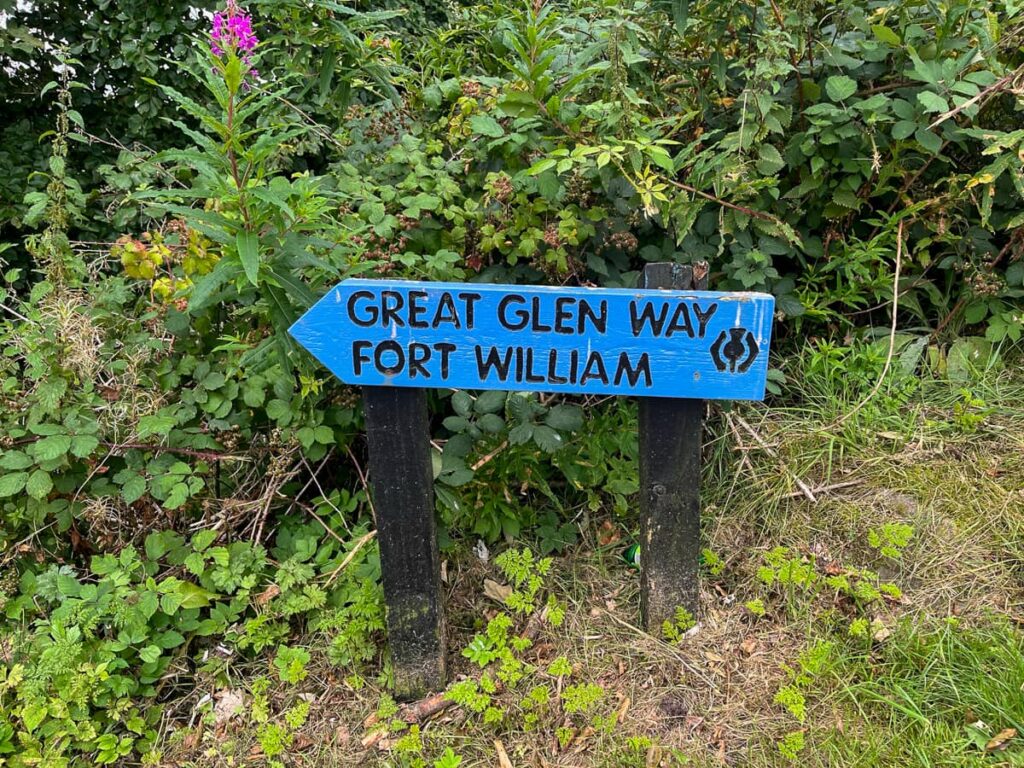 Official Great Glen Way trail signpost showing direction from Fort William to Gairlochy along the route