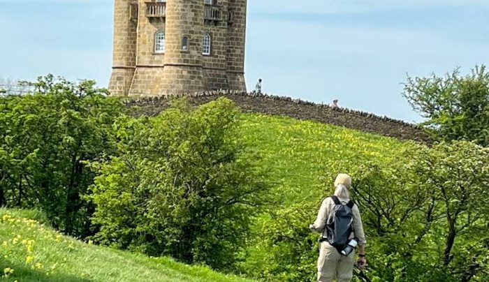 Absolute Escapes client walking towards Broadway Tower (Credit: Wade Weber)