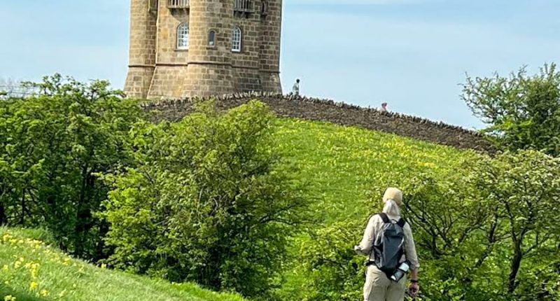 Absolute Escapes client walking towards Broadway Tower (Credit: Wade Weber)