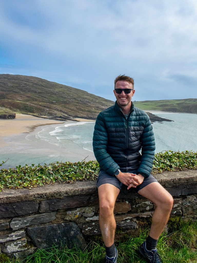 Our Marketing Manager, Scott in front of Barley Cove Beach - one of the most stunning beaches in Cork and a must-see on the Wild Atlantic Way driving route.