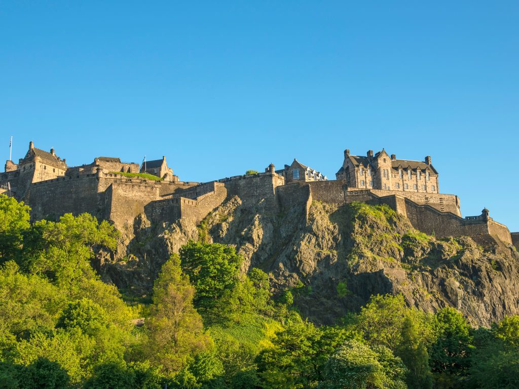 Edinburgh Castle in summer under clear skies, a popular highlight during the best time of year to visit the UK