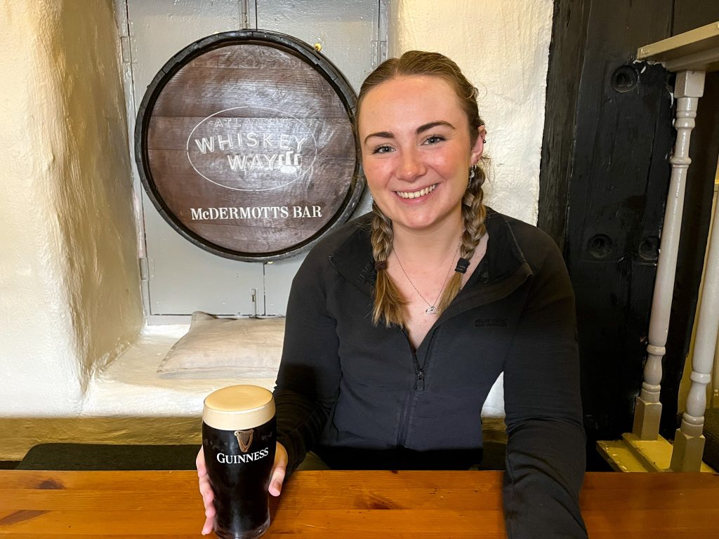 Our specialist, Kate, enjoying a Guinness at McDermott's Pub, Doolin - one of the best places to eat & drink in Co. Clare, on the Wild Atlantic Way