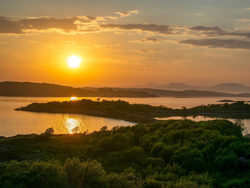 Long summer evening on the west coast of Scotland, showing why summer is the best time to visit Scotland and the UK